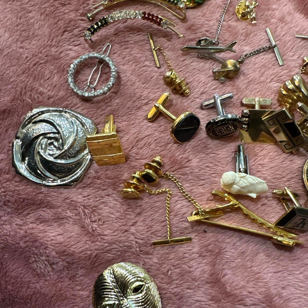Lot of cufflinks and and pins